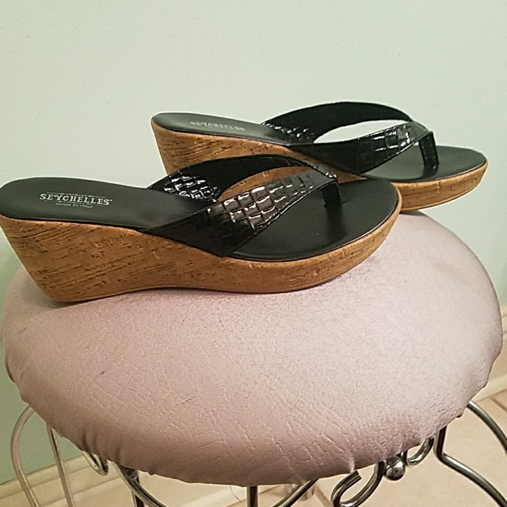 Black and brown platform flip flops